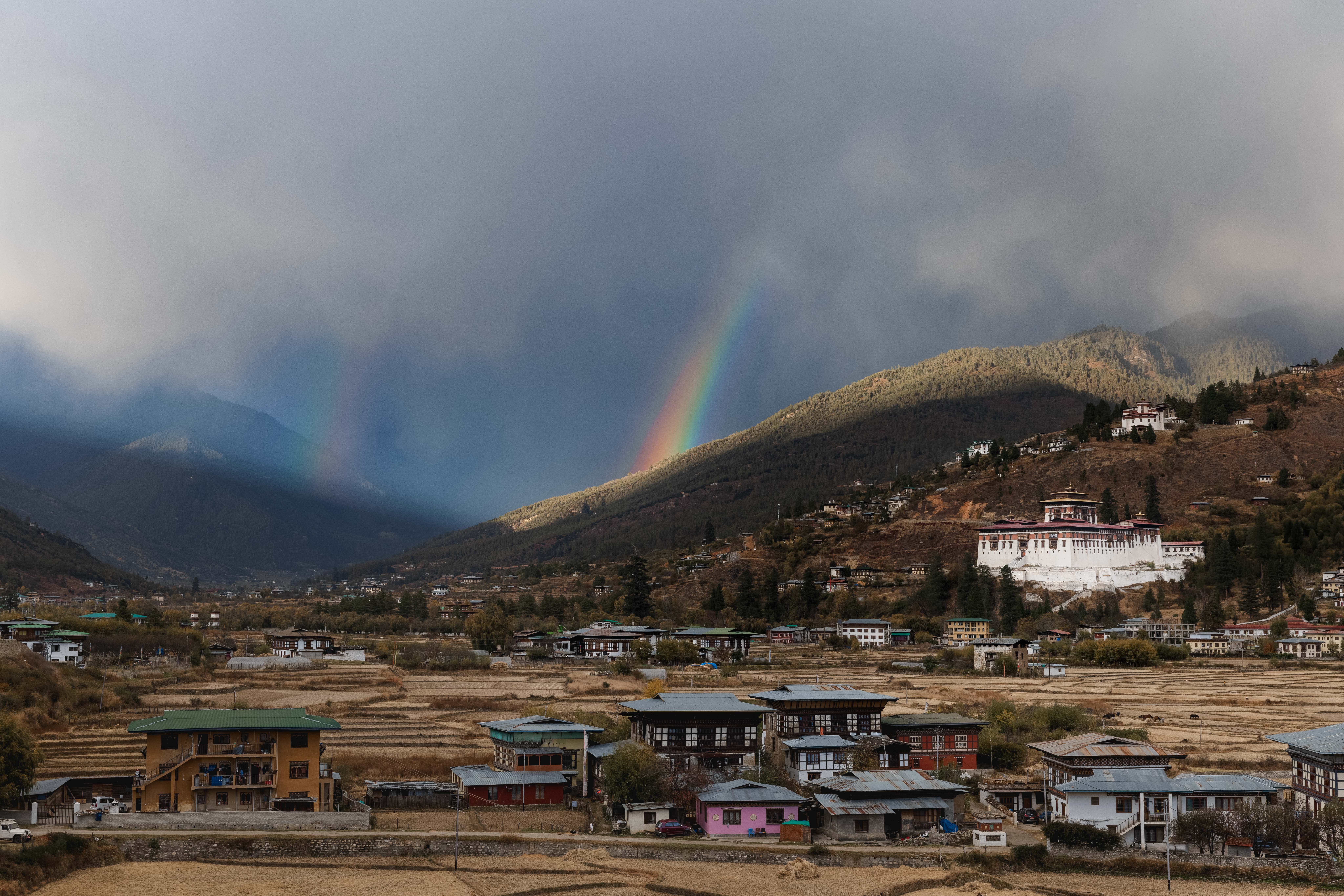 Rainbow over Paro dzong and valley