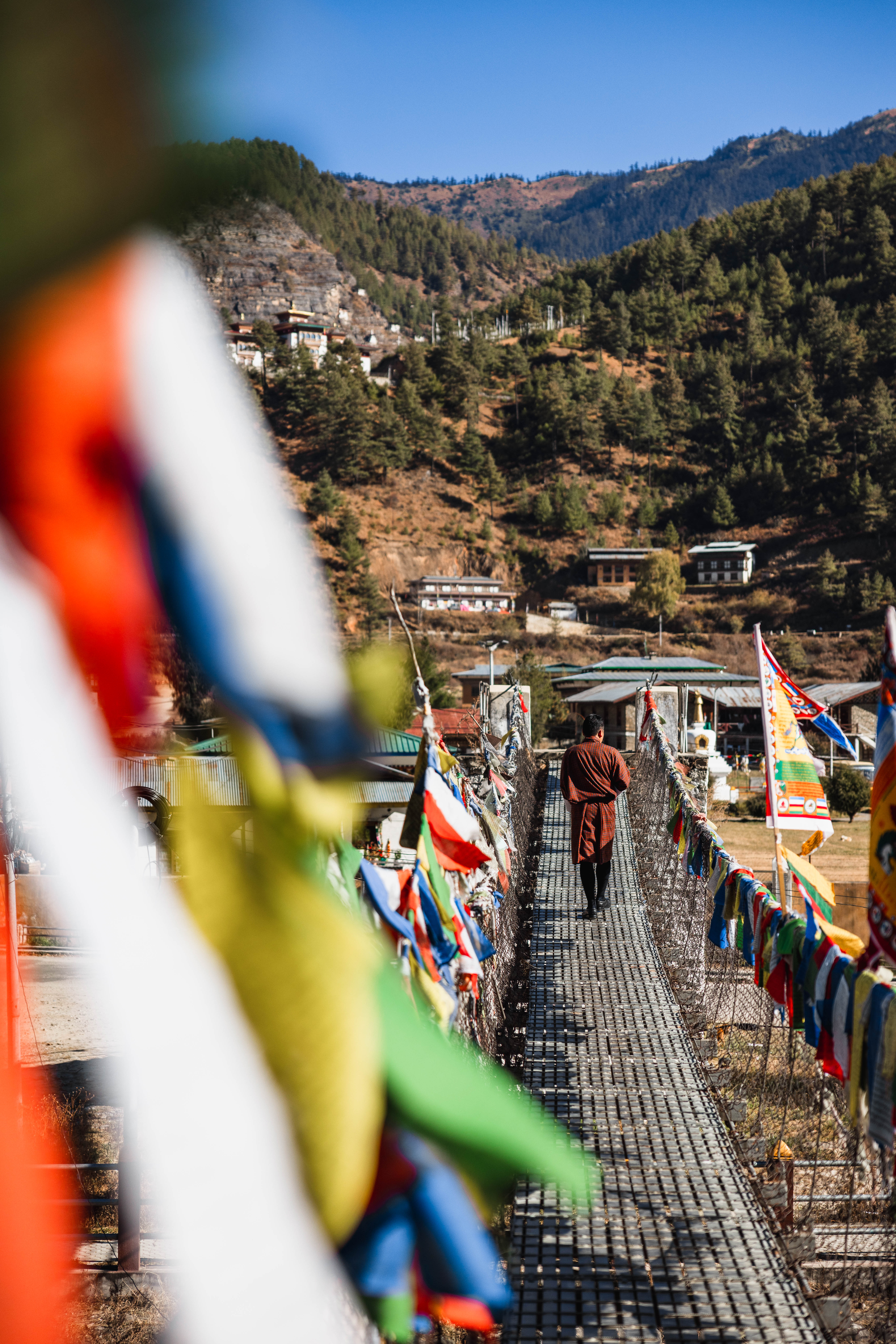 Walking a prayer-flag bridge